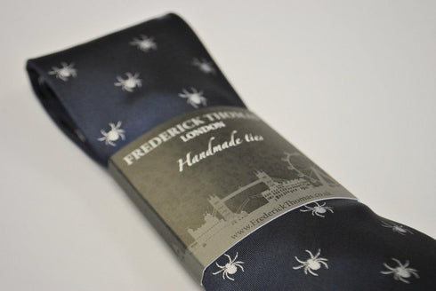 navy tie with white spider silhouette design